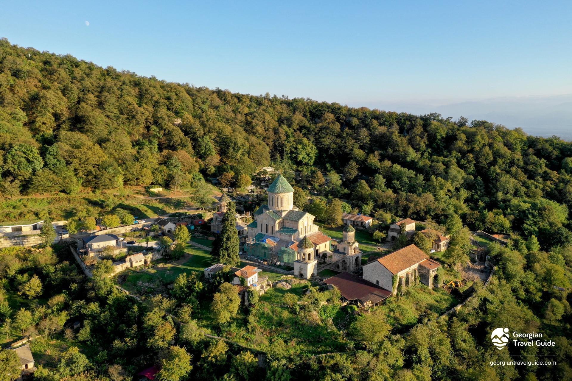 Gelati Monastery exterior with green hills