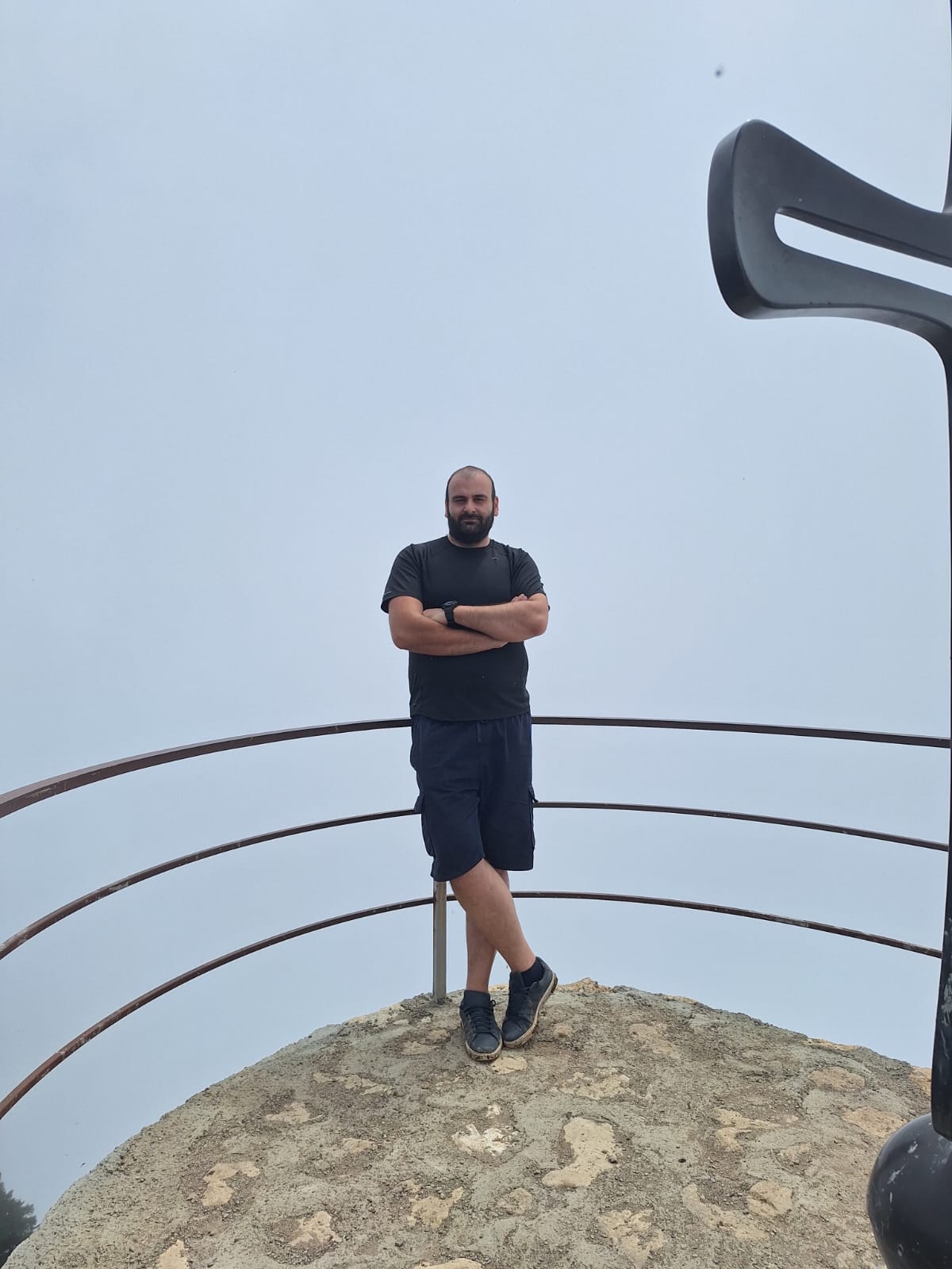 Standing at the mountain summit viewpoint